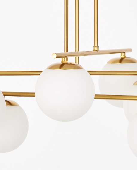 lampa wisząca z kulami w kolorze szczotkowanego złota widok z boku