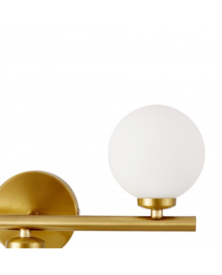 Detal białego szklanego klosza kinkietu na mosiężnym mocowaniu