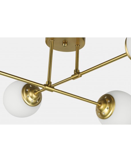 Detal mocowania lampy Fino 4 LED, złoto szczotkowane i geometryczna forma oprawy