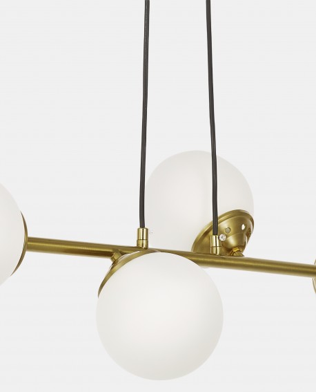 Lampa wisząca szczotkowane złoto z białymi kulami do salonu eleganckie oświetlenie wnętrza cztery klosze szklane Lampit