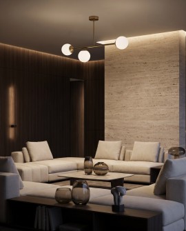 Szczotkowana złota lampa wisząca z białymi szklanymi kloszami w salonie